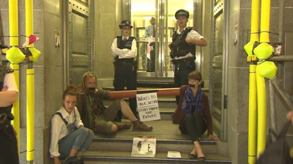 Fracking Protesters Superglue Themselves To Department for Enviroment